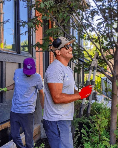 Rainfall Landscapes team tending a Calgary garden