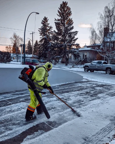 Rainfall team clearing a snowy path